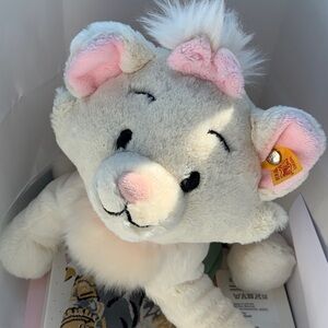 Adorable Plush Toy with Pink Accents